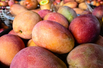 mango fruits in a basket at traditional marketplace