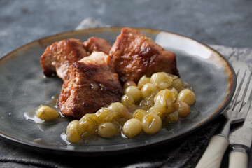 Fried pork with green gooseberry sauce