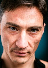 Close up vertical studio headshot portrait of young caucasian man stand look at camera posing, feel positive optimistic