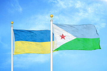 Ukraine and Djibouti two flags on flagpoles and blue sky