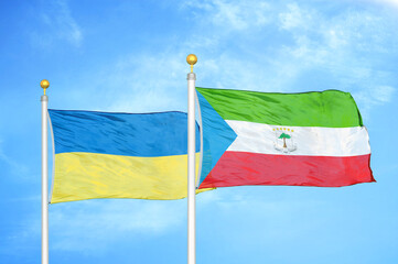 Ukraine and Equatorial Guinea two flags on flagpoles and blue sky