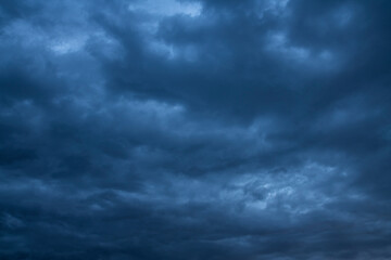 Beautiful dark stormy sky and blue dramatic clouds. Sky background.