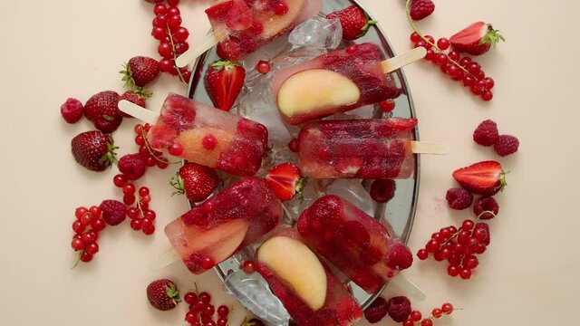 Homemade frozen various red berries natural juice popsicles - paletas - ice pops