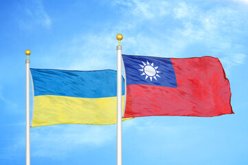 Ukraine and Taiwan two flags on flagpoles and blue sky