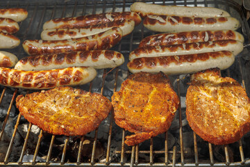 grilled meat and sausages on the grill