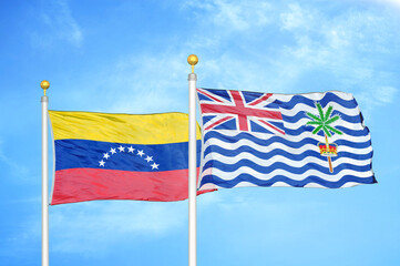 Venezuela and British Indian Territory two flags on flagpoles and blue sky