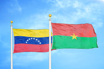 Fototapeta na wymiar Venezuela and Burkina Faso two flags on flagpoles and blue sky