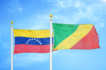 Venezuela and Congo two flags on flagpoles and blue sky