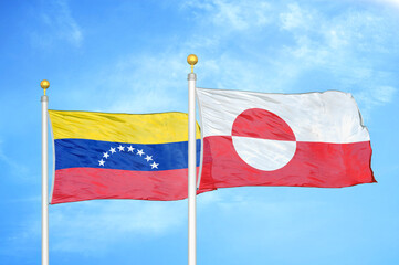 Venezuela and Greenland two flags on flagpoles and blue sky © Aleks Taurus