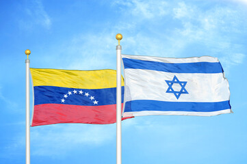 Venezuela and Israel two flags on flagpoles and blue sky