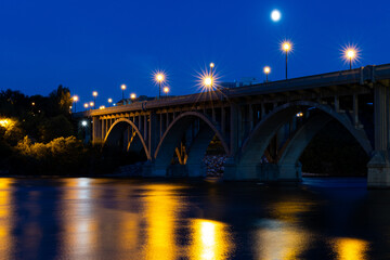 Fototapeta na wymiar A picturesque view of the Broadway Bridge and South Saskatchewan River in the City of Saskatoon late at night 