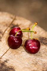 red cherries on wooden table