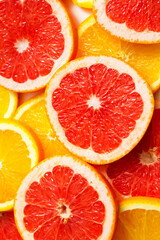 Fototapeta na wymiar citrus fruits background grapefruit cut into slices