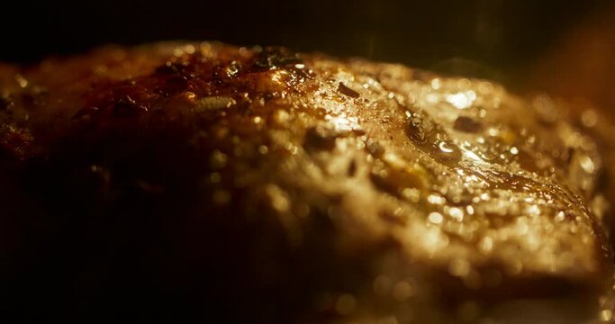 Chicken getting grilled. Extreme close up shot of chicken legs getting roated in oven. Preparation of fast food. Unhealthy food with trans fats 4k footage