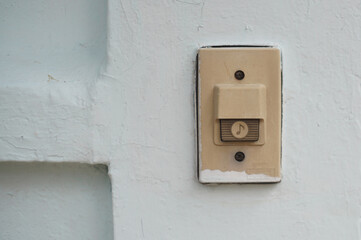 Close-up a Doorbell ring on fence door of home.