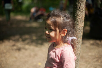 Girl 4 years old in the forest. Little girl of Asian appearance