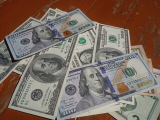  dollars on an old shabby floor, poverty and wealth concept
