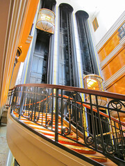 View into lobby or atrium on modern cruise ship liner or cruiseship with elevators and dramatic...