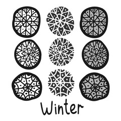 Vector black and white isolated decorative set of snowflakes and winter text