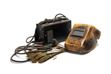 Welding mask with welding machine, protective gloves, and arc steel electrodes. Kit of used welding...
