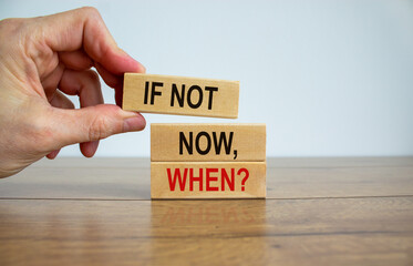 Male hand placing a blocks with word 'if not' on top of a blocks tower. Text 'if not now, when'....