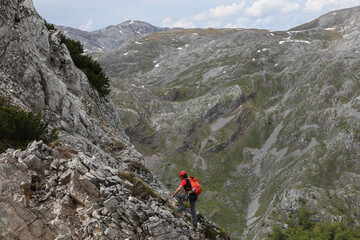Fototapeta na wymiar Climbing to the top of rocky peak