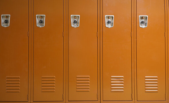 facade view of lockers in school gym painted in brown color