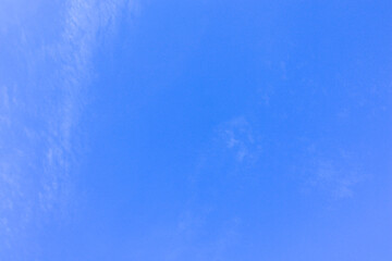 Blue sky with a thin white cloud