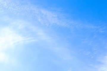 Blue sky with a thin white cloud