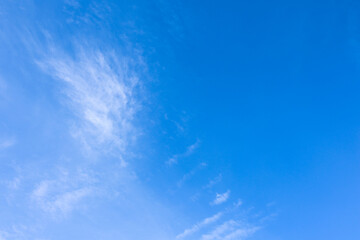 Naklejka na ściany i meble Blue sky with a thin white cloud