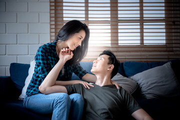 Portrait images of Asian couples stare at each other in the eyes, showing love and romance, concept to feelings of people who are in love with one asother