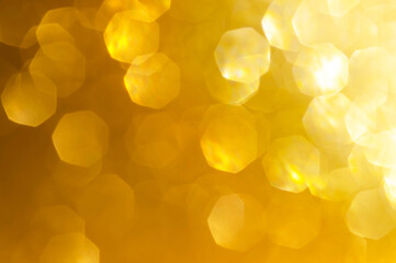 Gold,yellow abstract light background,Gold bokeh shining lights,sparkling glittering Christmas lights.Season greeting background.New year Luxury backdrop image.Blurred abstract holiday background.