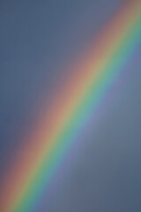 Vertical image of gorgeous rainbow in the sky
