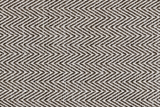 Dark brown with beige colors fabric sample Herringbone,zigzag pattern texture backdrop.Fabric strip line,Herringbone pattern design,upholstery for decoration interior design background..
