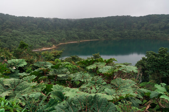 Extinct volcanic Crater Lake Botos surrounded by tropical jungle