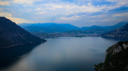 Fototapeta na wymiar Aerial view over the Lake Lugano in Switzerland - evening view - drone footage