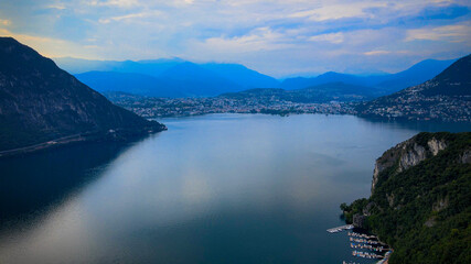 Aerial view over the Lake Lugano in Switzerland - evening view - drone footage