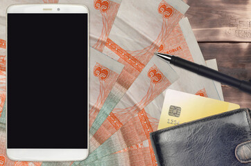 3 cuban pesos convertibles bills and smartphone with purse and credit card. E-payments or...
