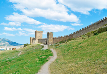 View of the path to the fortress on the green rock
