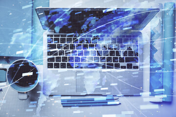 Multi exposure of data theme drawing hologram over topview work desk background with computer. Concept of technology.