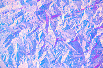 Blurred abstract Modern pastel colored holographic background in 80s style. Crumpled iridescent...