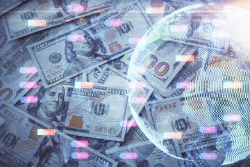 Double exposure of world map drawing over us dollars bill background. International concept.