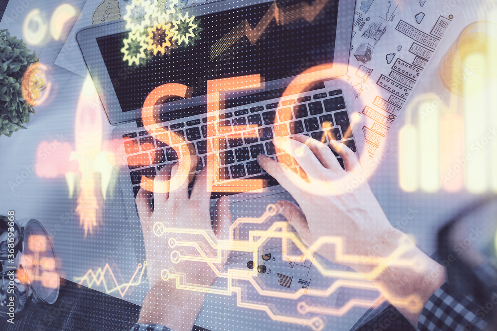 Poster Multi exposure of man's hands typing over computer keyboard and SEO hologram drawing. Top view. Search optimization concept.