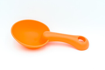 Beach toys: a sand scoop on a white background