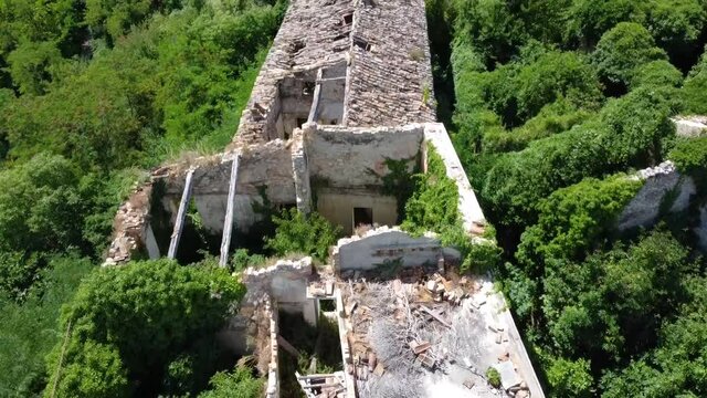 Italy 2020: Aerial view of the abandoned town of Faraone Vecchio. Nature, slowly, is embracing all slowly deteriorating constructions. July 2020, Abruzzo