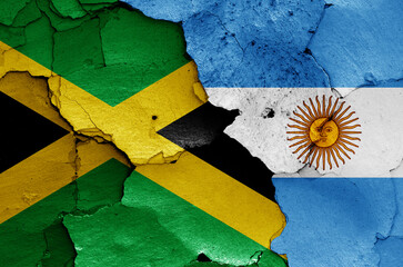 flags of Jamaica and Argentina painted on cracked wall