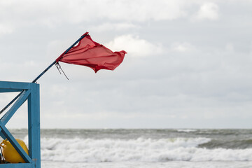 Red flag meaning no swimming in the sea. Baltic Sea, Poland.
