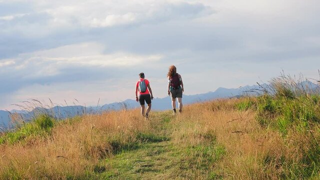Girls having trekking walk in the alps of Lake Como