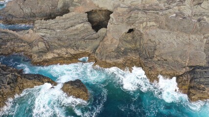 mighty ocean spitting out the cliffs