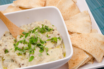 Baba ghanoush a appetizer of mashed cooked eggplant mixed with tahini 